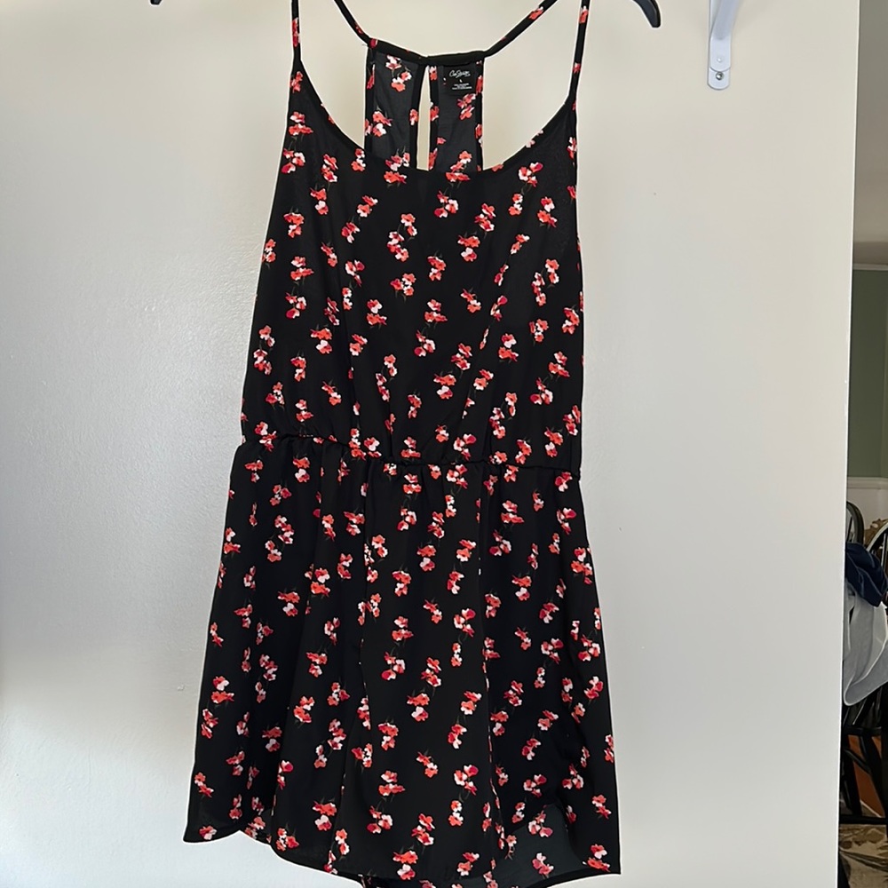 Super cute romper - sleeveless w cute button neck closure.